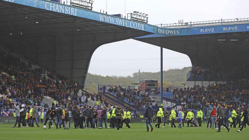 Sheffield Wednesday fans enter pitch to protest against club ownership