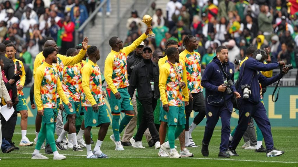 Defiant Senegal displays AFCON trophy before beating Peru in friendly
